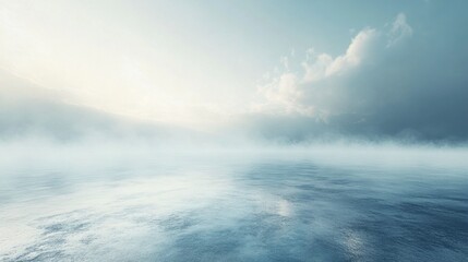 Naklejka premium A serene, misty landscape where the calm water meets the soft, cloudy horizon under a pale sky, evoking a sense of tranquility and peace.