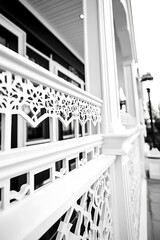 Elegant monochrome architecture featuring ornate white balcony railings