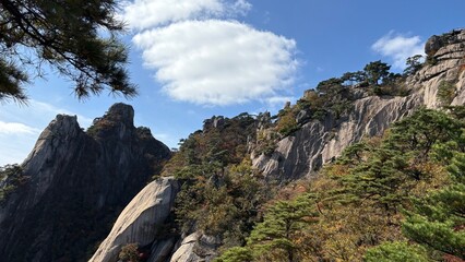 The magnificent scenery of rock mountains and clear autumn skies