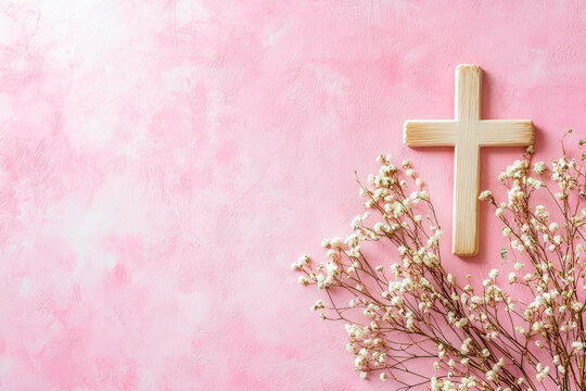 pink communion background with copy space with white flowers and rosary