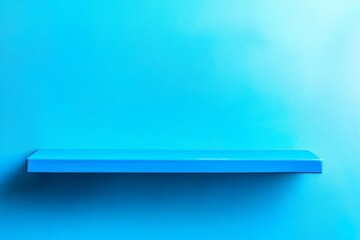 Blue Shelf Against Blue Wall - A single, empty, light blue shelf is mounted on a matching blue wall, providing a clean and minimalist background for product display or design mockups