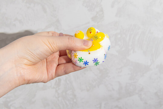 Woman holds anti-stress squish toy cat's paw. Silicone anti-stress toy