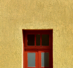 textured yellow wall and red wooden window 2