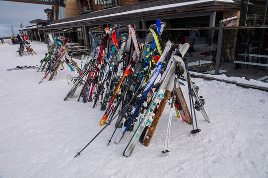Rack packed with skis in the snow on a winter sports resort. Trysil, Norway - February 27, 2025.