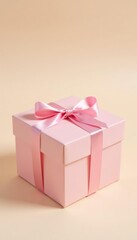 Obraz premium Pastel pink present box on a cream background, pale pink gift, soft gift box