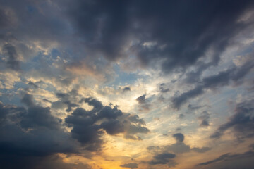 Sunset in the city, dramatic sky with clouds and sun.