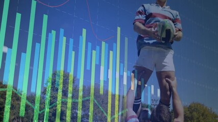 Rugby player holding ball with financial data processing animation over blue sky - Powered by Adobe