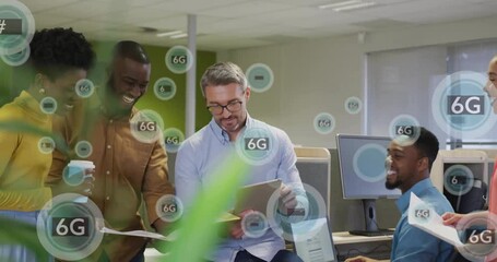 Diverse team discussing documents in office with 6G technology animation overlay - Powered by Adobe