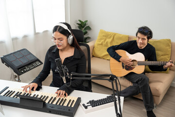 Professional Musician with condenser microphone and tablet for Mixing Mastering music. Music...