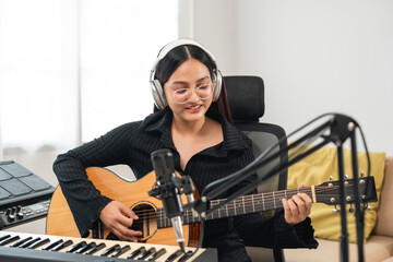 Professional Musician with condenser microphone and tablet for Mixing Mastering music. Music...