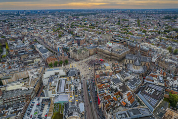 Stunning aerial view of Koninklijk Paleis - The Royal Palace in Amsterdam showcasing its iconic architecture, the iconic Town squareand vibrant cityscape.