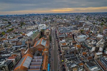 Stunning aerial view of Koninklijk Paleis - The Royal Palace in Amsterdam showcasing its iconic architecture, the iconic Town squareand vibrant cityscape.