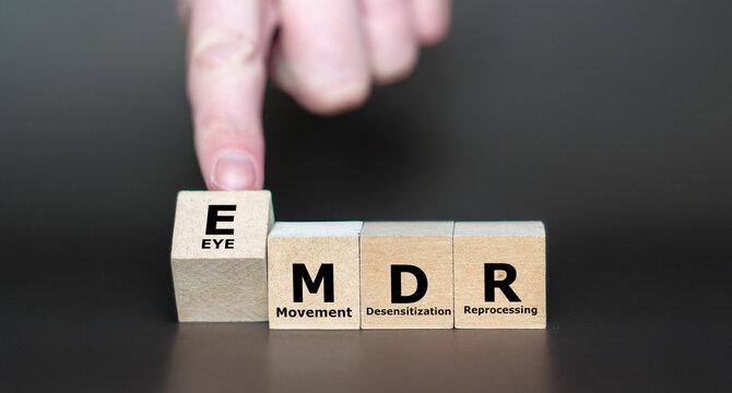 Cubes form the Expression EMDR, which stands for Eye Movement Desensitization and Reprocessing. EMDR is a psychotherapy treatment that is designed to alleviate the distress with traumatic memories.