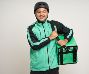 Young asian rider wearing green jacket uniform and bike helmet various action with delivery box. Male delivery service worker. Courier and shipping food service to customer online application