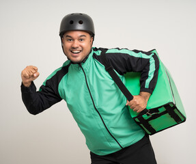 Young asian rider wearing green jacket uniform and bike helmet various action with delivery box. Male delivery service worker. Courier and shipping food service to customer online application