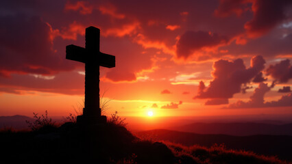 Cross on a hill at sunset with clouds and mountains in the background.