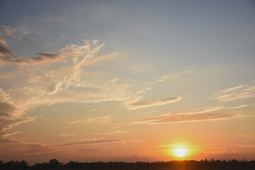 Orange sky with clouds at sunset