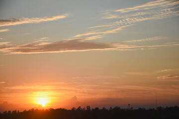 Orange sky with clouds at sunset