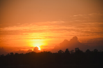 Orange sky with clouds at sunset