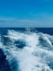 foam and spray on the sea water