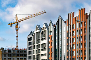 New house construction. Facades of luxury modern residential houses