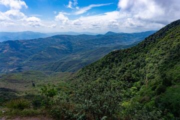 Panoramic View Of Amboro National Park Bolivia With Dense Rainforest Mountains And Misty Clouds Covering The Lush Green Tropical Landscape