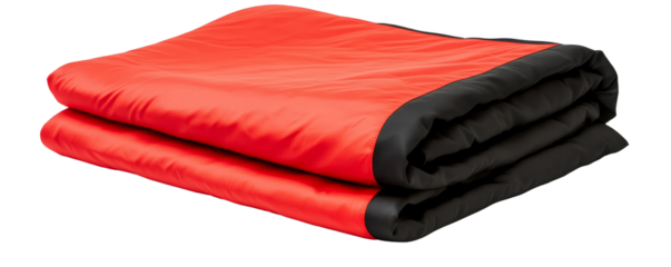 Bright red sleeping bag for outdoor adventure. A folded red and black insulated camping blanket made from durable, weather-resistant material, designed for outdoor adventures, warmth, and comfort.