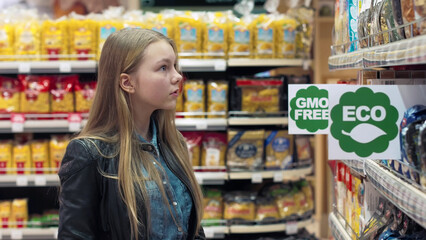 People in the supermarket Eco-friendly products go between the rows and choose