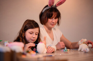 Fototapeta premium Mother and Daughter Enjoying Easter Crafting Together