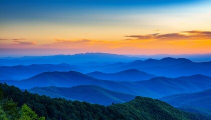 Fototapeta premium bright blue color dominates the blue ridge mountains at sunset