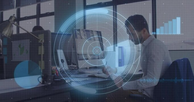 Business professional working at desk with digital data overlay animation