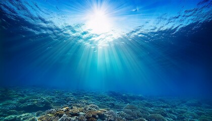 Fototapeta premium sun shining light in blue clearly deep water sunbeams illuminate the blue underwater sea scene background