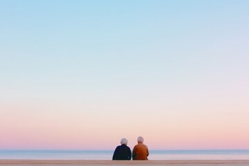 peaceful elder couple enjoys sunrise on beach symbolizing secure future with savings and pensions