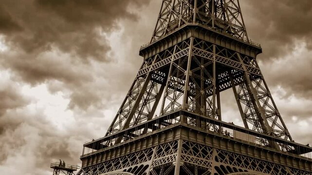 The Eiffel Tower Stands Majestically Under Dramatic Skies A Striking Black and White Image