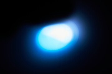 Abstract Blue Light Glow on Dark Background
