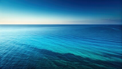 Obraz premium a serene seascape with an endless expanse of blue ocean meeting a clear, graduated sky