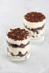 Brownie cake trifle, Black forest dessert with chocolate biscuit , whipped cream and cherries. Vegan dessert. Vertical orientation.