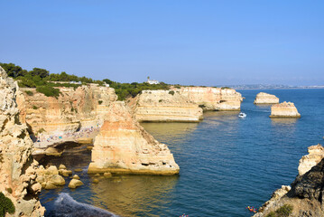 walking path with breathtaking views through the coast from porches to benagil caves lagoa algarve portugal