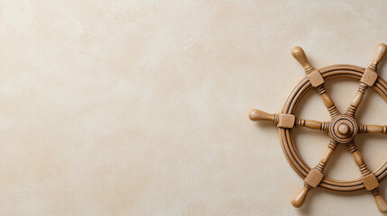 Wooden ship wheel on textured beige background, evoking nautical themes and adventure