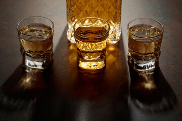 Decanter and small glasses of whiskey.