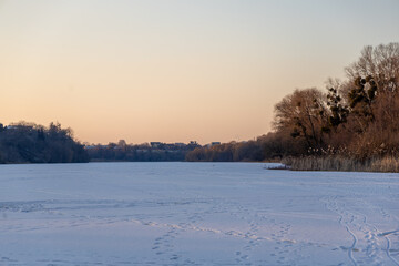 Evening winter landscape on a frozen river
