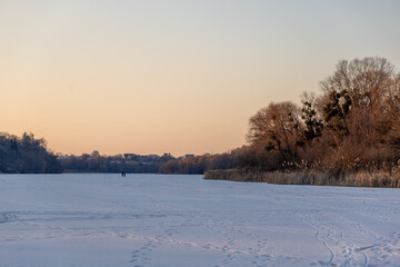 Evening winter landscape on a frozen river