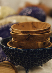 Colorful handmade wooden utensils at a market stall. Minimalist lifestyle. Shopping at local...