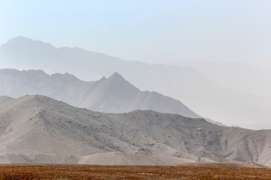 Serene Desert Landscape With Layered Mountains and Dry Terrain Under a Clear Sky, Cabul, Afganistan