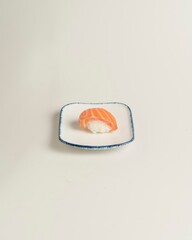 Fresh Salmon Sushi on White Plate with Minimalist Presentation