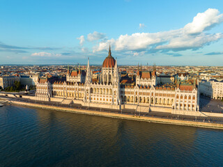 Aerial view Residence of Hungarian Parliament, Budapest. National building symbol view from opposite bank of Danube River backdrop of sunset on sunny day in summer. Travel destination. Tourism