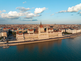 Aerial view Residence of Hungarian Parliament, Budapest. National building symbol view from opposite bank of Danube River backdrop of sunset on sunny day in summer. Travel destination. Tourism