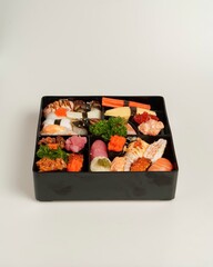 Delicious Sushi Platter Organized in Elegant Black Box Presentation