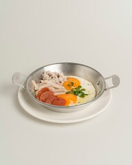 Breakfast Pan with Eggs, Sausage, Chicken, and Herbs on Plate