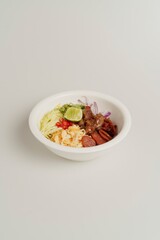 Colorful Bowl of Fresh Vegetables and Meat on a Light Background